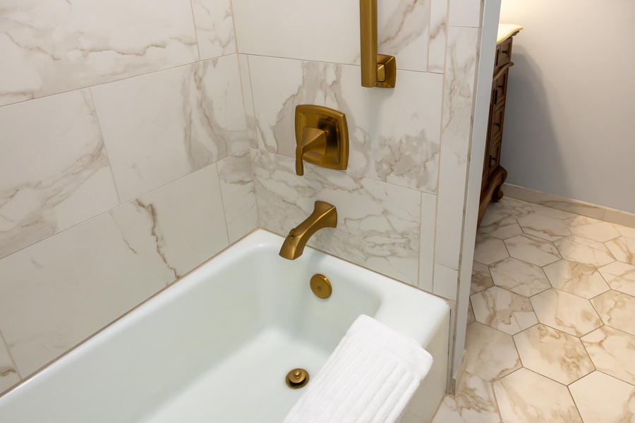 a bathtub and faucet in a bathroom
