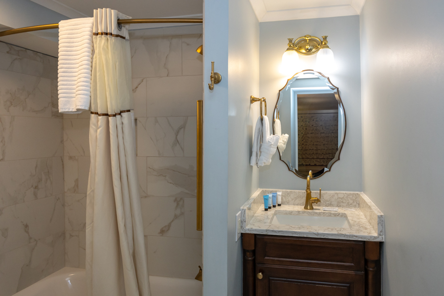 a bathroom with a sink and mirror
