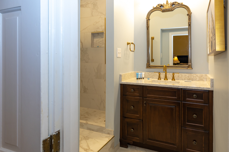 a bathroom with a mirror and sink
